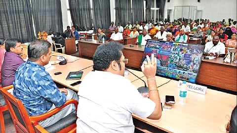 DMK MP Kathir Anand seen addressing the audience after
muting the video call in which the PM was still interacting
with farmers in Vellore on Tuesday.