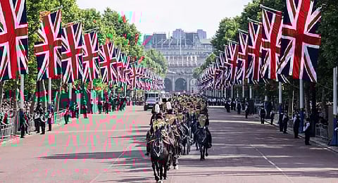 The Kings troop of the royal horse artillery ride down the Mall on their way to fire ceremonial gun in London