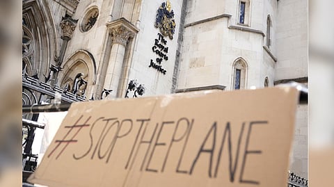 A placard left outside the High Court