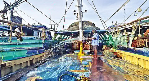 A fisherman preparing the boat in Chennai ahead of the fresh season as the annual ban will be lifted on Wednesday