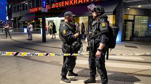 Security forces stand at the site