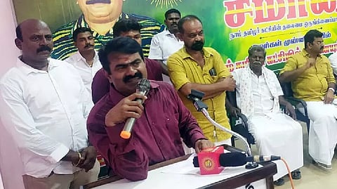 Seeman giving the speech