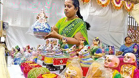 Women SHG member displaying dolls