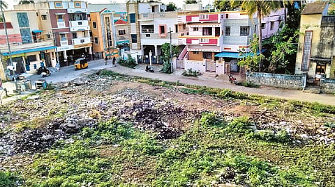 The vacant plot where garbage is being burnt frequently at Balaji Nagar in Anakaputhur Municipality