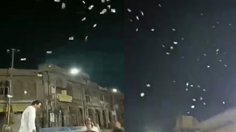Man tossing Rs 500 notes in air
