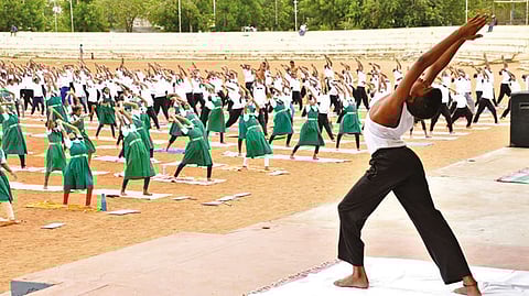 Students from various schools performing asanas at BHEL grounds in Tiruchy on Tuesday