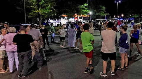 Church members gather for a prayer circle after a shooting