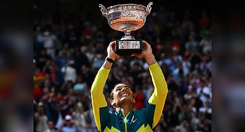 Rafael Nadal lifts the French Open trophy for the 14th time