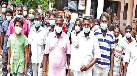 Residents on their way to hand over a petition to Erode Collector against closure of Tasmac shop in their locality on Monday
