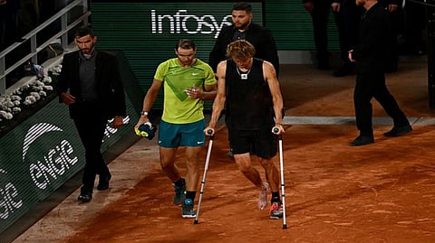 Rafael Nadal walks with Alexander Zverev