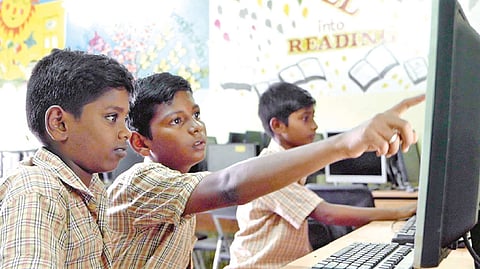 Students exploring computer programme