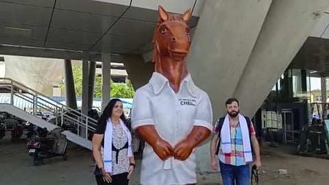 International players near toy statue set up at Chennai airport.