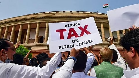 Opposition MPs stage a protest against inflation and the Union government's decision to increase GST on food items, at Parliament complex, in New Delhi.