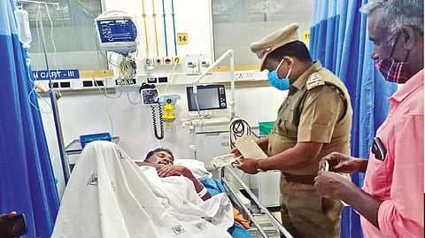 Forest department staff hands over interim cash compensation to the gaur attack victim