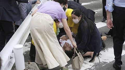 Shinzo Abe lying on the ground after being shot