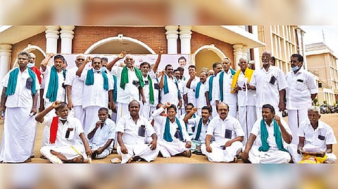 Farmers with black badges demonstrate outside the Collectorate in Thanjavur on Friday