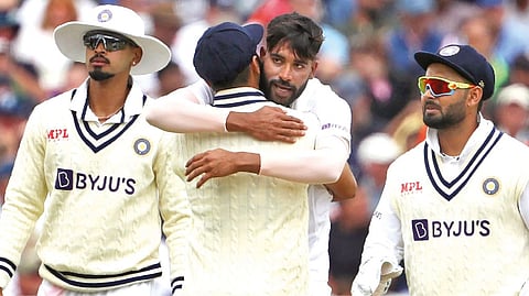 India?s Mohammed Siraj celebrates with teammates after taking the wicket of Sam Billings