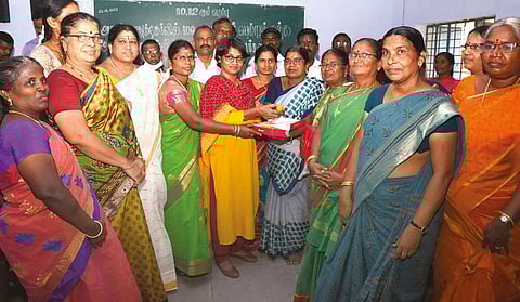 Perambalur Collector P Venkada Priya with government school teachers who achieved 100 per cent results in classes 10, 11 and 12 exams
