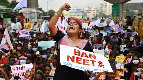 SFI members stage a protest against holding of the NEET exam
