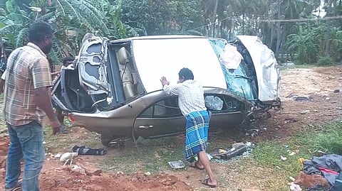 Locals help to move the occupants out of the car