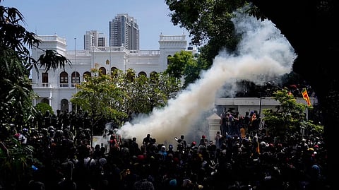 Police use teargas as Sri Lankan protesters storm the compound of Prime Minister Ranil Wickremesinghe's office