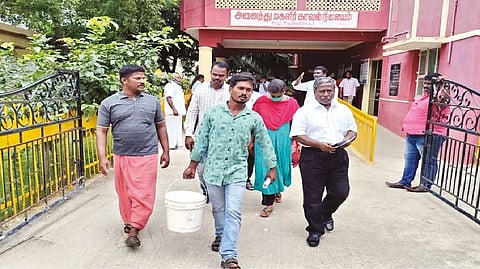 Kamanuthattu hamlet residents coming out of Ambur taluk police station after filing a complaint
