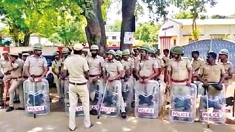 Police keep guard in front of Sacred Heart GHSS in Tiruvallur as emotions ran high following the suicide of a girl student