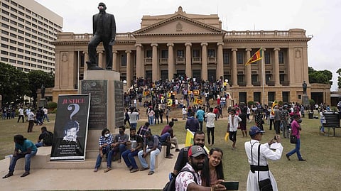 Protesters walk around and spend time at the ongoing protest site