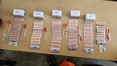 Seized tablets and syringes.