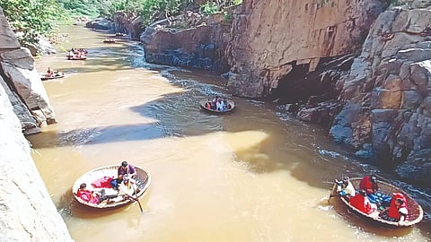 Tourists enjoy coracle rides in Hogenakkal on Wednesday.