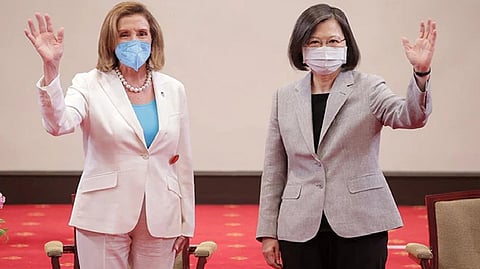 US House Speaker Nancy Pelosi (L) waving beside Taiwan's President Tsai Ing-wen at the Presidential Office in Taipei