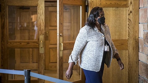Lisa D. Cook, a member of the Board of Governors of the Federal Reserve System, takes a break at the central bank's annual symposium.