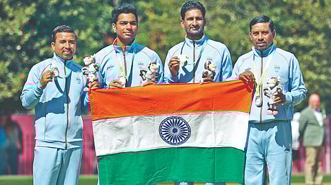 India?s silver medalists (from left) Sunil Bahadur, Navneet Singh, Chandan Kumar Singh and Dinesh Kumar pose after Men?s Fours bowls