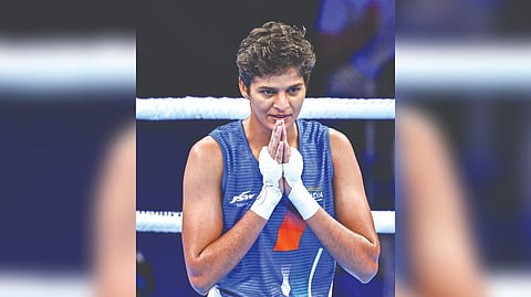 India?s Jasmine reacts after winning the quarter-final bout