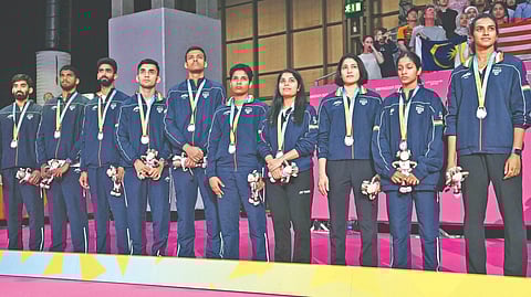 India badminton team poses with silver medal