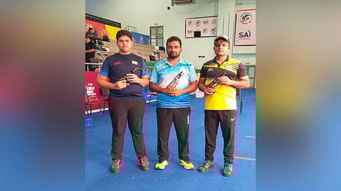 Shooter Chain Singh (in centre) after winning Men's 50m Rifle Prone T5
