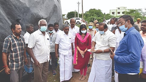 Food Minister R Sakkarapani inspecting an open godown in Tiruvarur on Friday