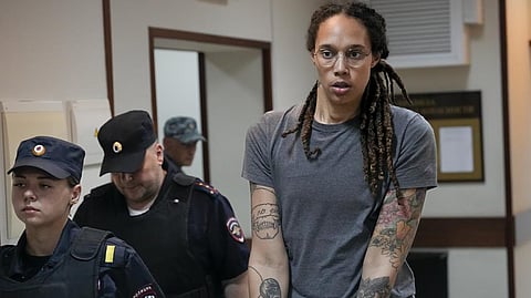 Brittney Griner is escorted from a court room after a hearing