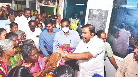 Minister KN Nehru distributing essentials at a relief camp in Tiruchy on Friday