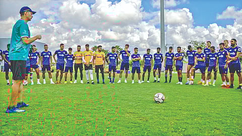 Chennaiyin FC head coach Thomas Brdaric and players at a training session.