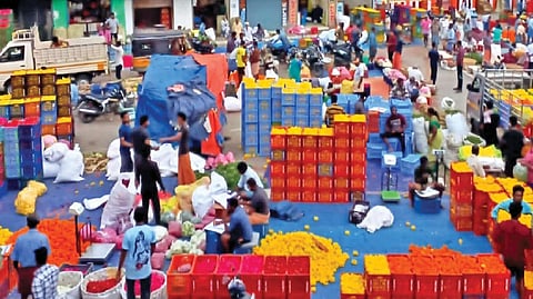 Flowers arriving at wholesale market in Thovalai Kanniyakumari district on Tuesday