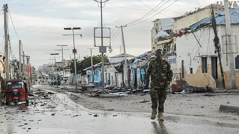 A Somali security officer walks past a section of Hotel Hayat
