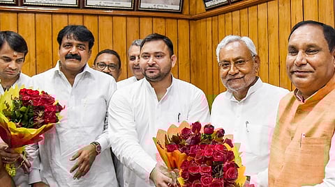 Bihar chief minister Nitish Kumar and deputy CM Tejashwi Yadav greet acting speaker Maheshwar Hazari