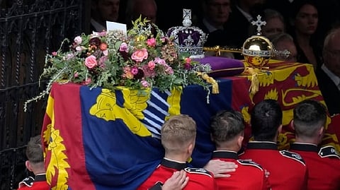 Queen Elizabeth II's Funeral: Pall bearers carry the coffin of Queen Elizabeth II at Windsor Castle
