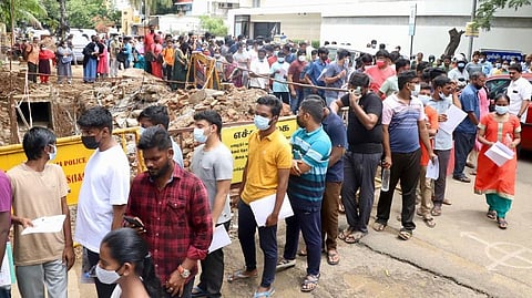 Candidates standing in queue at an exam centre in Nungambakkam