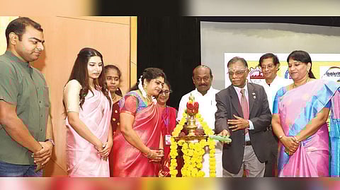 Justice (retd) P Jyothimani lighting the lamp at the State-level conference and workshop on women entrepreneurship.