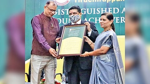 State Finance Minister Palanivel Thiaga Rajan receiving the Distinguished Alumni Award from NIT