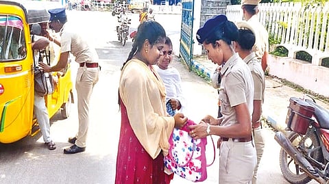 Police frisking the public entering the Collectorate