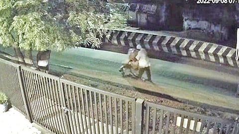 CCTV grab of Muruganandam pushing the body of his mother to crematorium on a wheelchair