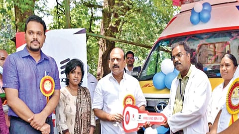 Minister TM Anbarasan flagging off battery operated stretchers and ambulance